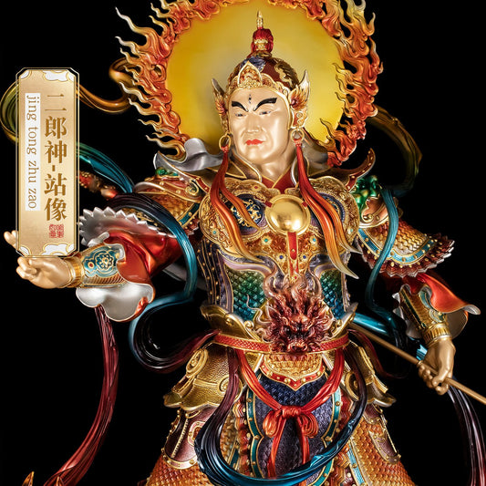 Close-up of brass Erlang Shen statue, detailed face and third eye