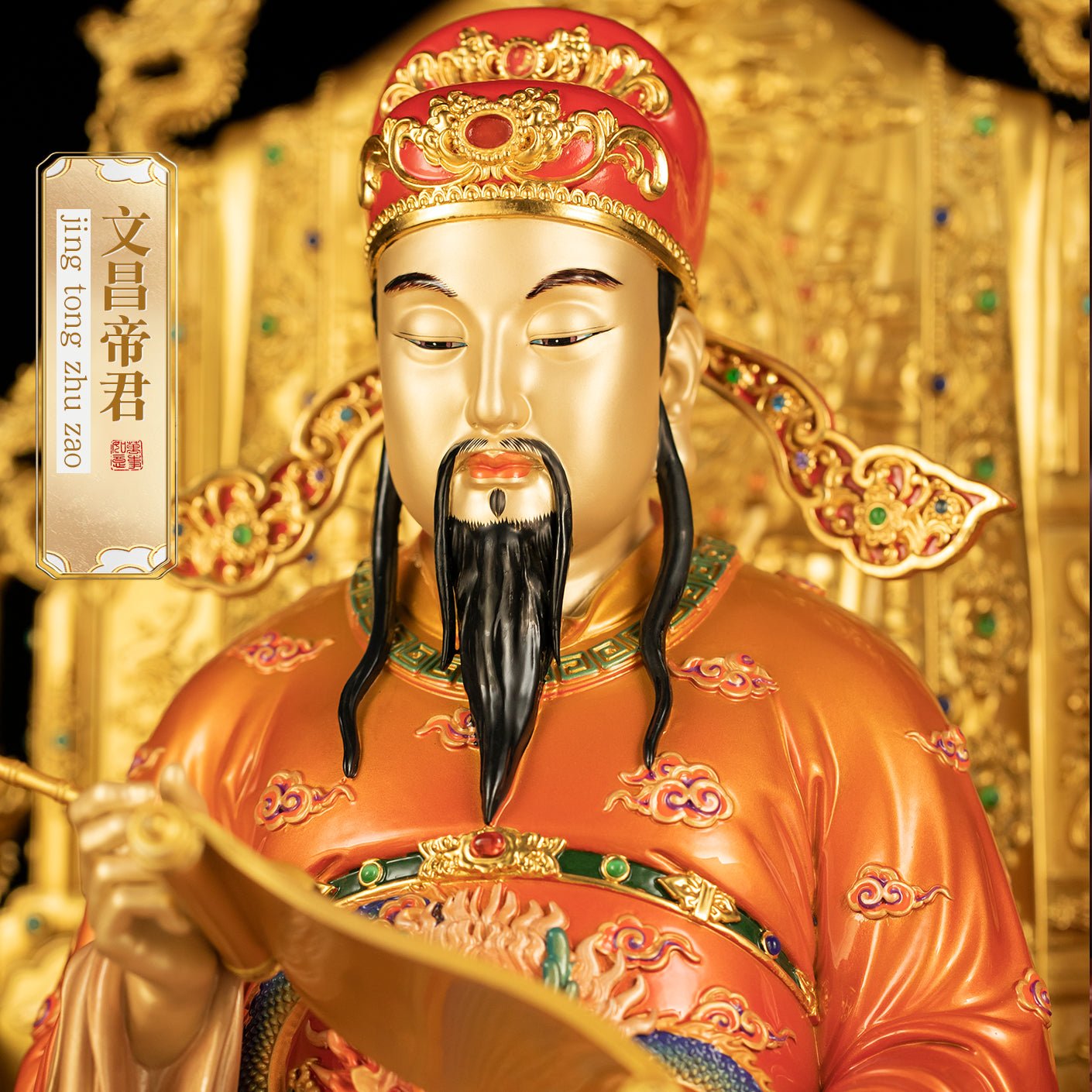 Close-up of brass Wen Chang statue, detailed face and official hat