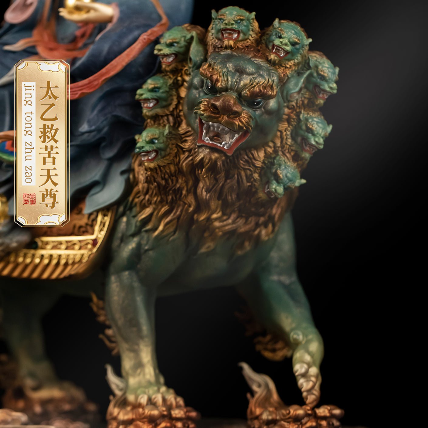 Enameled brass Tai Yi Tian Zun statue, holding divine artifact